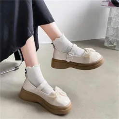 Ivory Bow Mary Jane Platforms