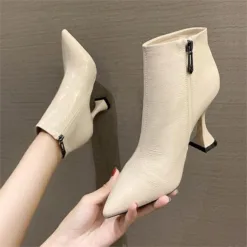 Sleek Ivory Pointed Ankle Boots